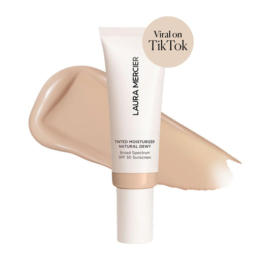 Texture swirl demonstrates sheer to light coverage on Laura Mercier tinted moisturizer.
