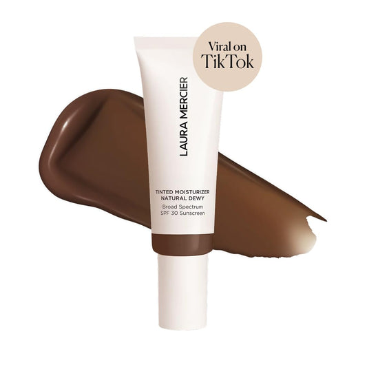 Close-up swatch on skin demonstrates sheer to light buildable coverage