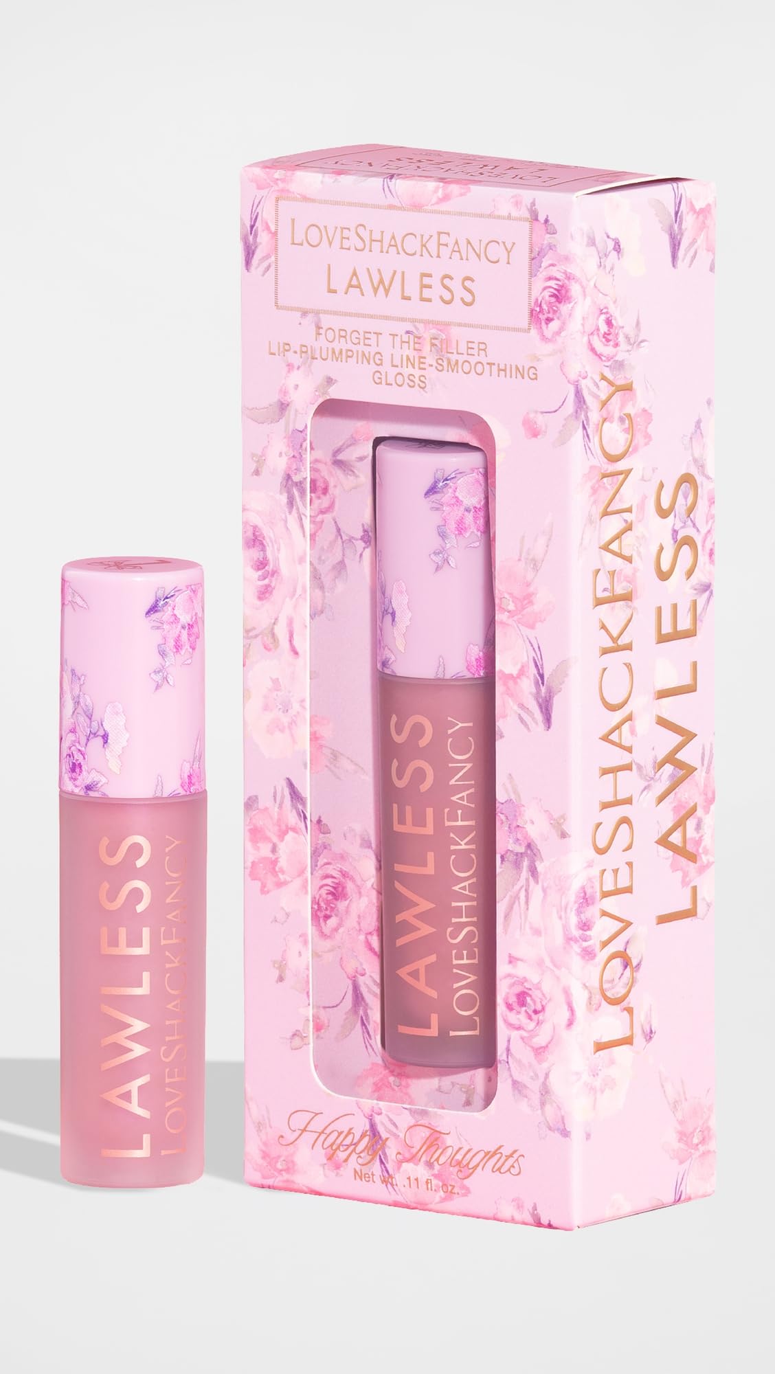 Close-up swatch of Lawless gloss in Happy Thoughts pink for day-to-night wear.
