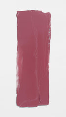 Applying Lawless Minx for smooth, hydrated lip color.