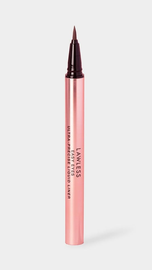 Close-up of the precision brush applying Lawless liner for smooth control.