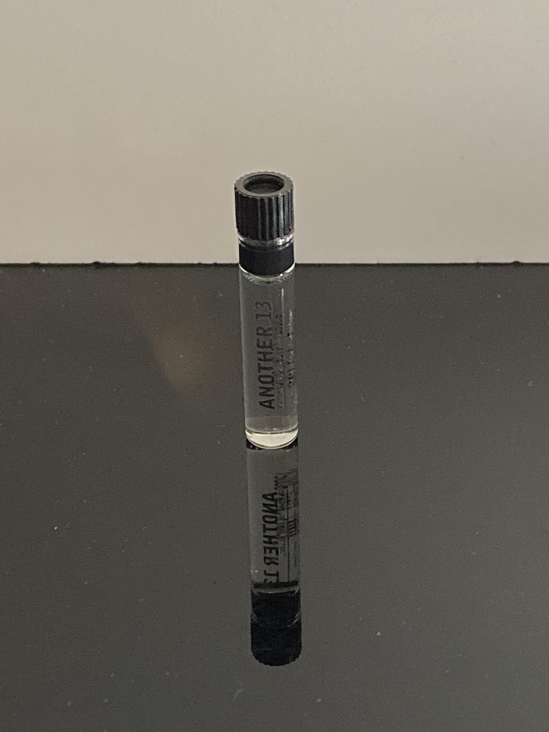 Label detail of Le Labo Another 13 dabber highlighting branding.
