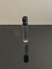Label detail of Le Labo Another 13 dabber highlighting branding.