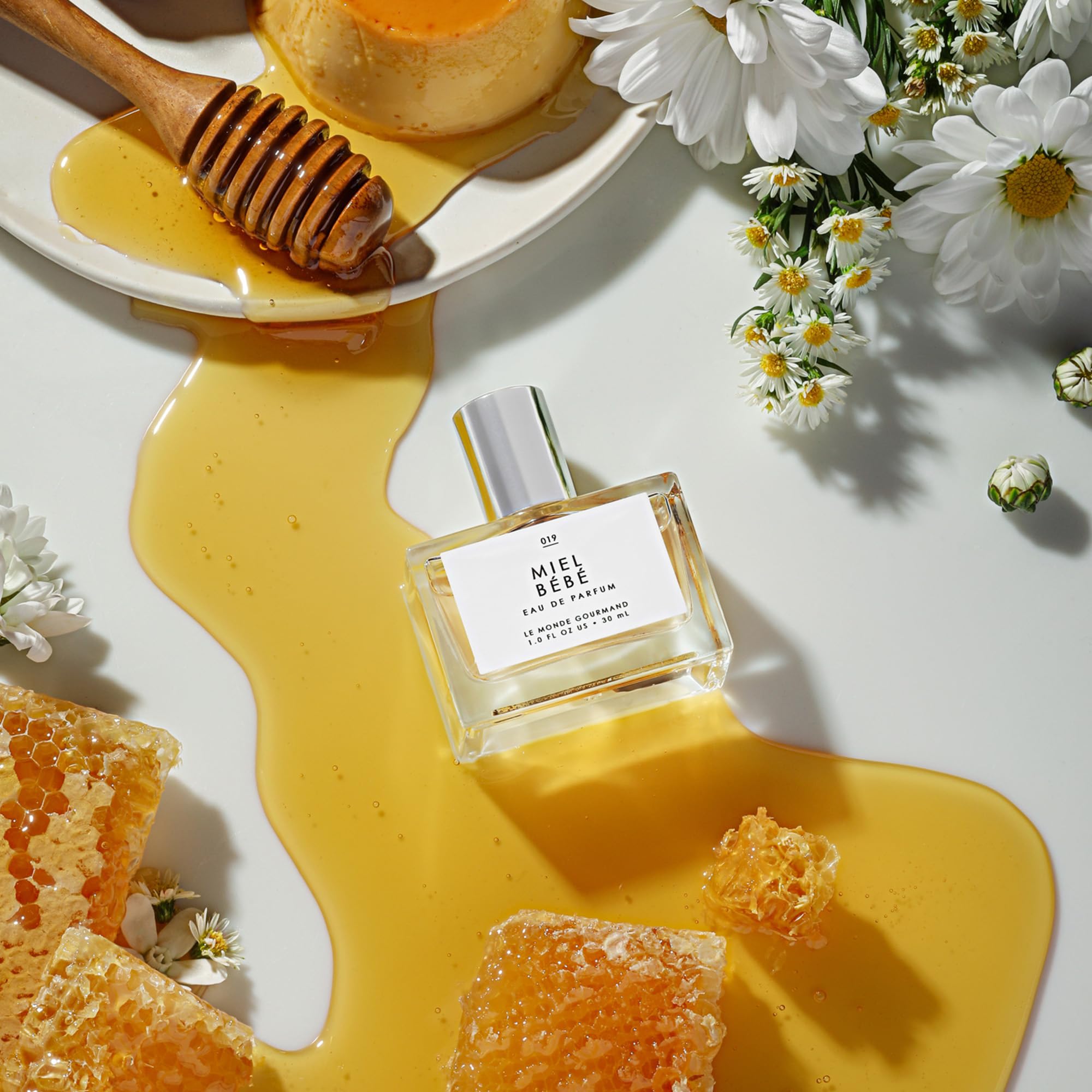 Le Monde Gourmand Miel Bébé label detail highlights praline and mandarin accents