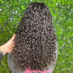 Close-up of Leaf & Flower curl cream texture showing soft hold on waves.