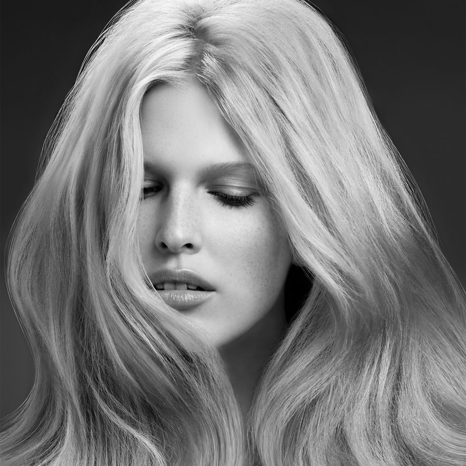Color-treated hair appears protected by the shampoo's color-safe formula.
