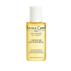 Leonor Greyl L'Huile Pre-Shampoo bottle shown, protecting hair from sun and chlorine.