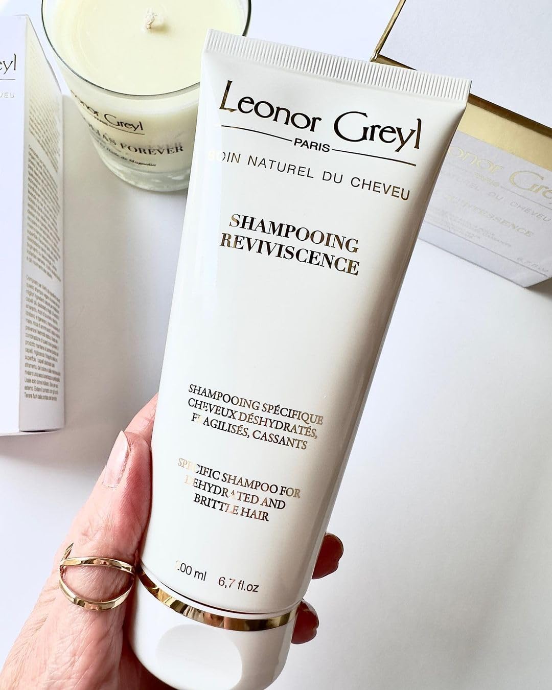 Rinsing reveals softer, shinier hair with revitalized texture using Reviviscence.