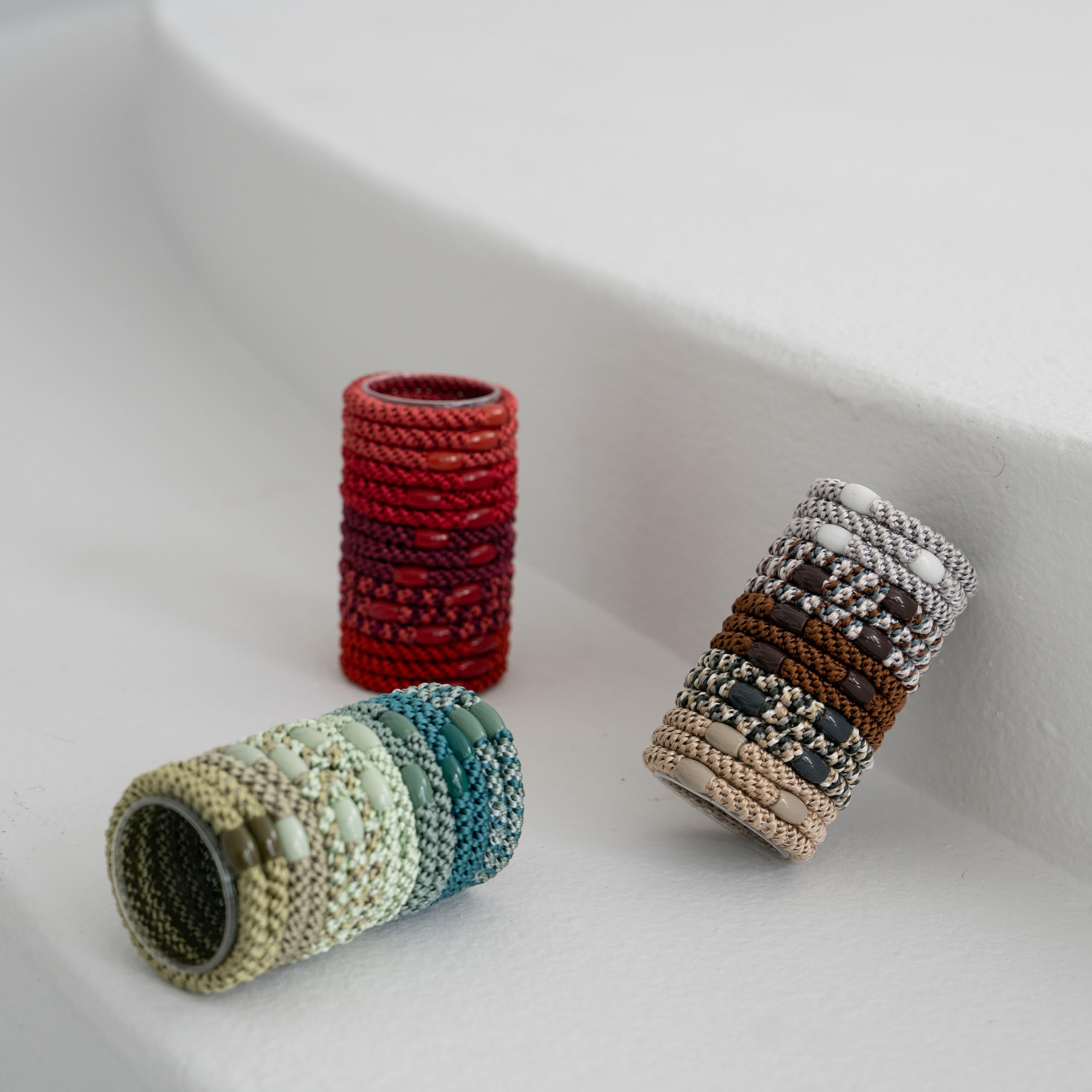 L. Erickson matching-tone beads add subtle style to each tie