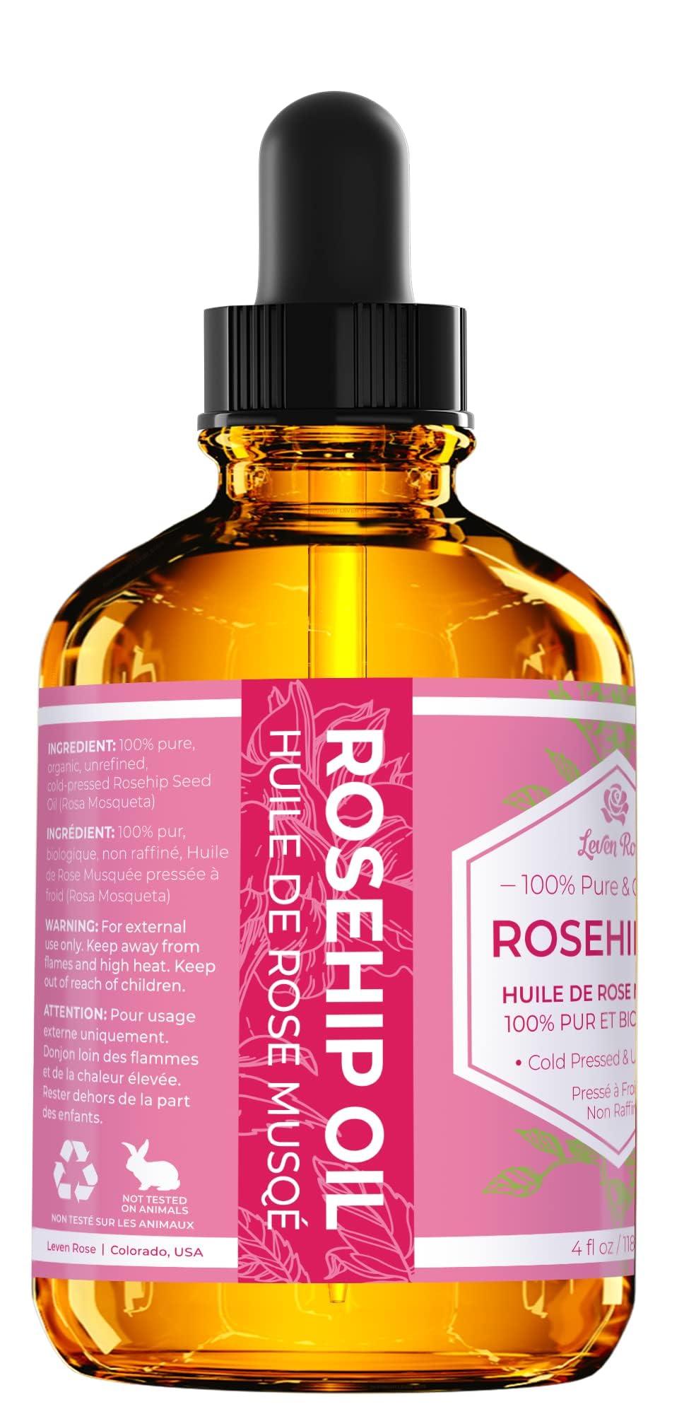Leven Rose rosehip oil dropper ready for precise nighttime care.