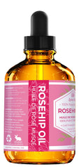 Leven Rose rosehip oil dropper ready for precise nighttime care.