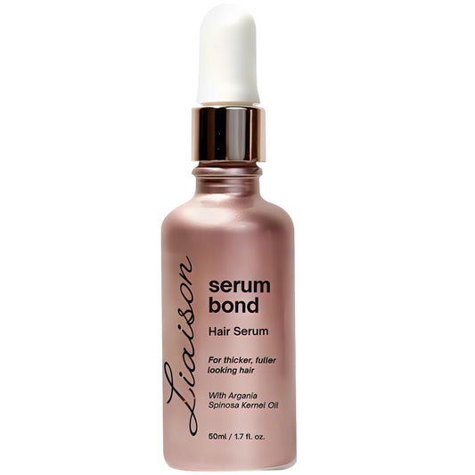 Liaison Hair Growth Serum bottle close-up, showcasing nourishing formula for healthier, fuller hair.