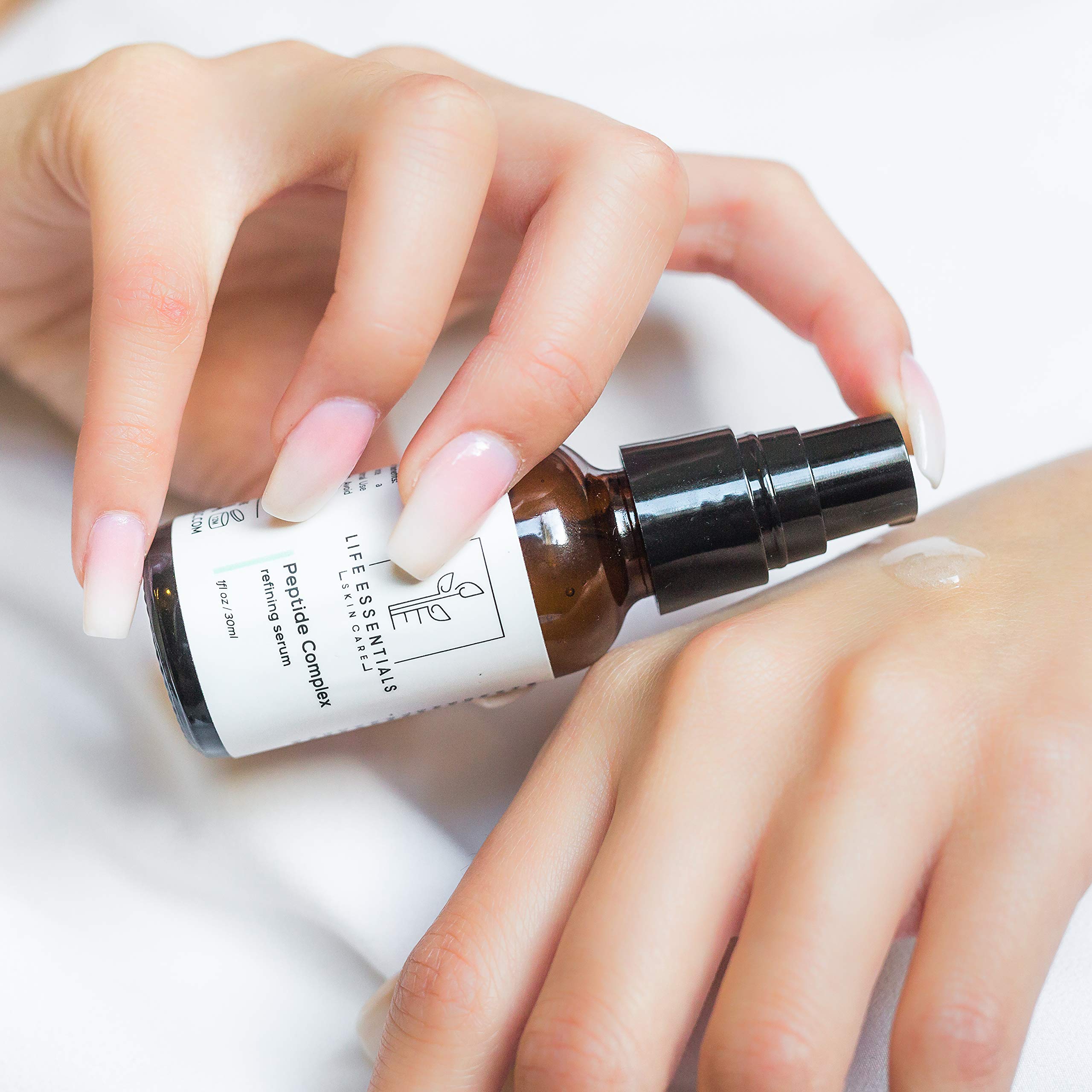 Life Essentials Skin Care Peptide Complex Serum texture closeup shows silky, fast-absorbing formula