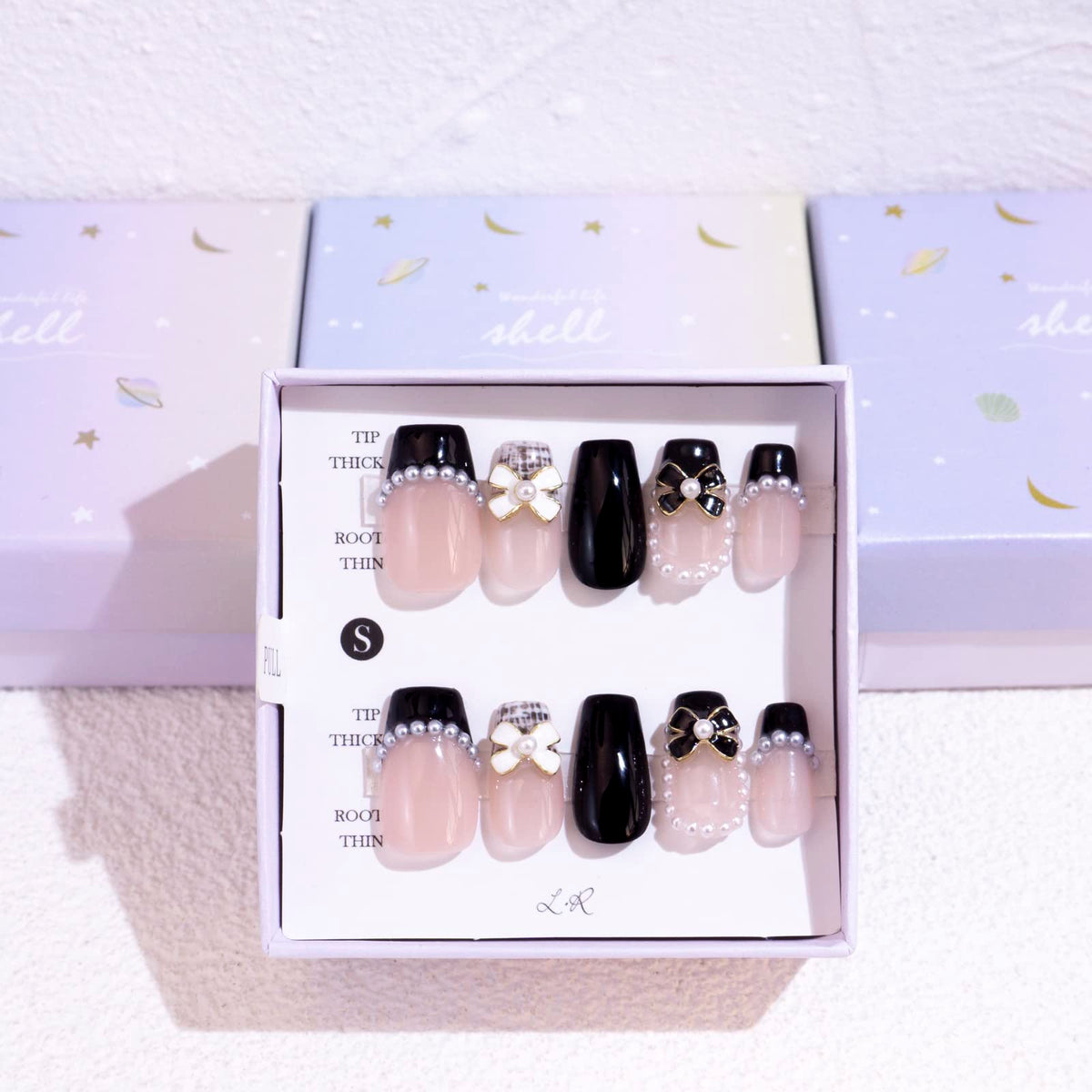 Light Rain hand-made nails design close-up with 3D gel finish for salon-quality look.