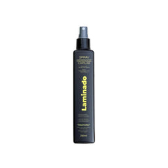 Lina Zapata heat protectant spray bottle ready for safe heat styling