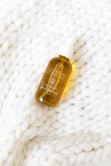 Amber glass bottle from Little Seed Farm preserves freshness and sustainability.