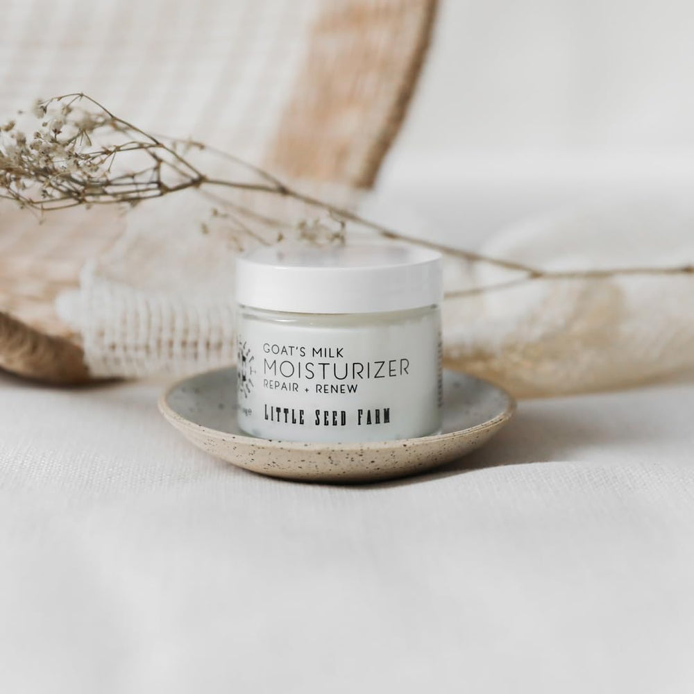 Ingredients bottle for Little Seed Farm Goat's Milk Face Moisturizer presents clean, organic formula benefits.