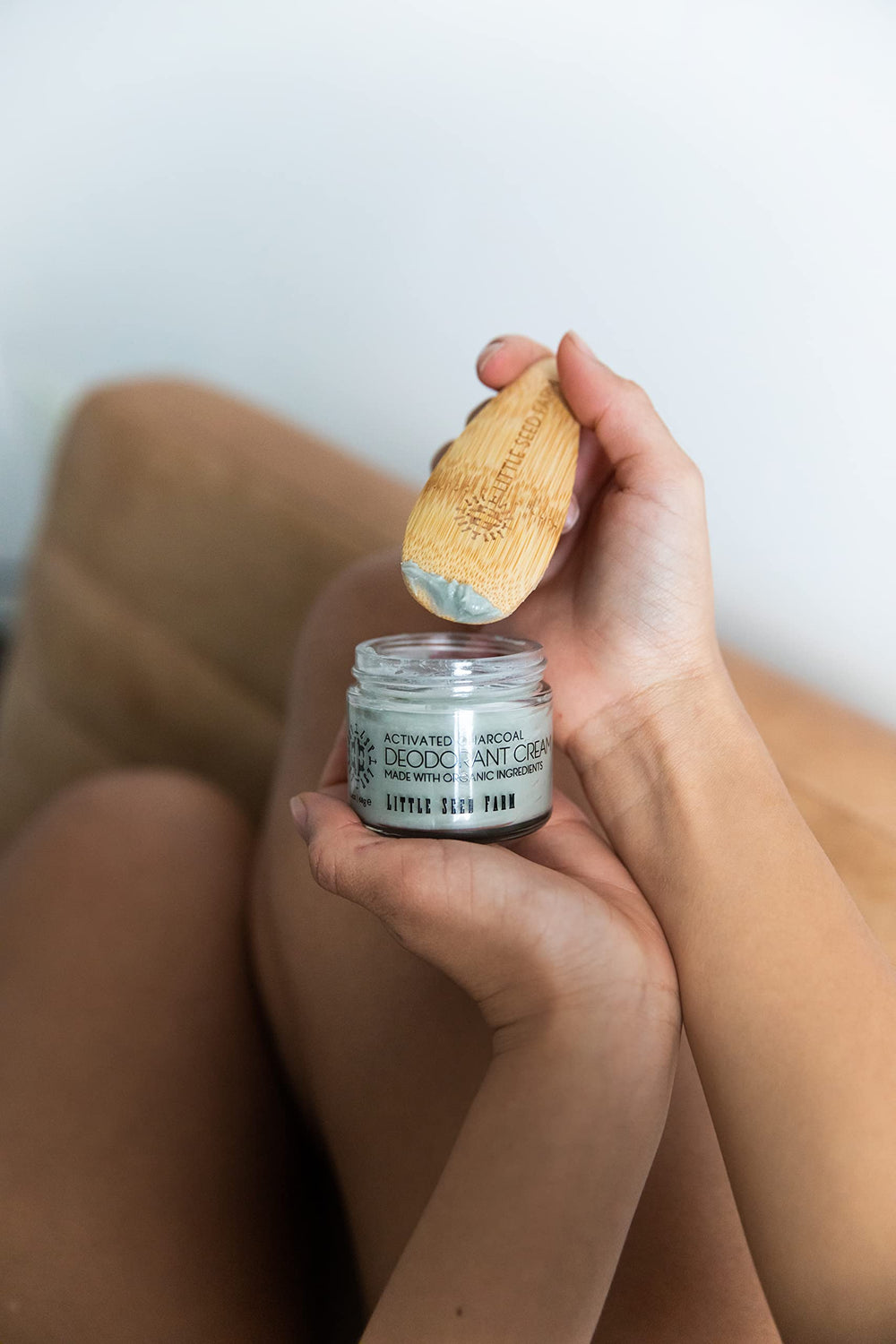 Underarm close-up showing silky glide with Little Seed Farm deodorant.