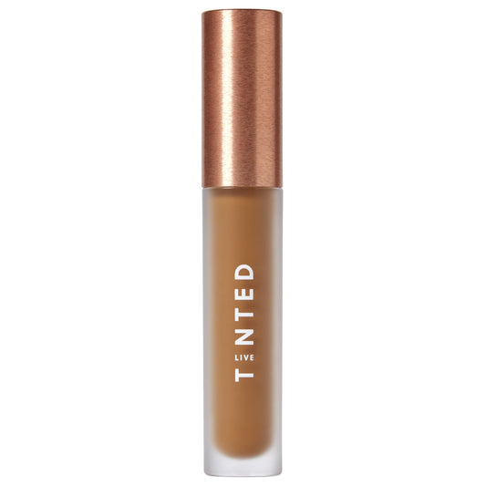 Live Tinted Hueskin Serum Concealer bottle close-up showing buildable coverage for dark circles