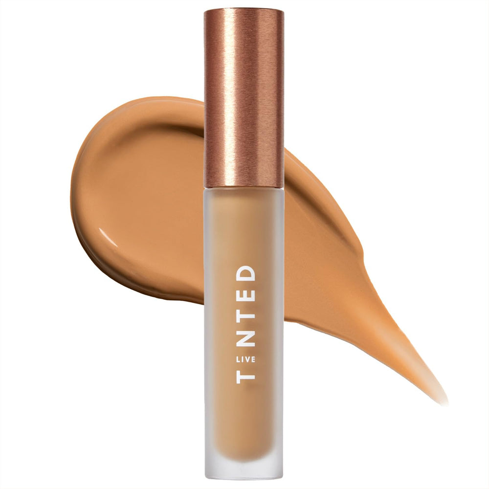 Live Tinted Hueskin Serum Concealer shade 10 swatch on arm demonstrates buildable coverage.