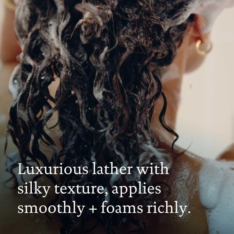 Hands applying products for detangled, hydrated hair routine