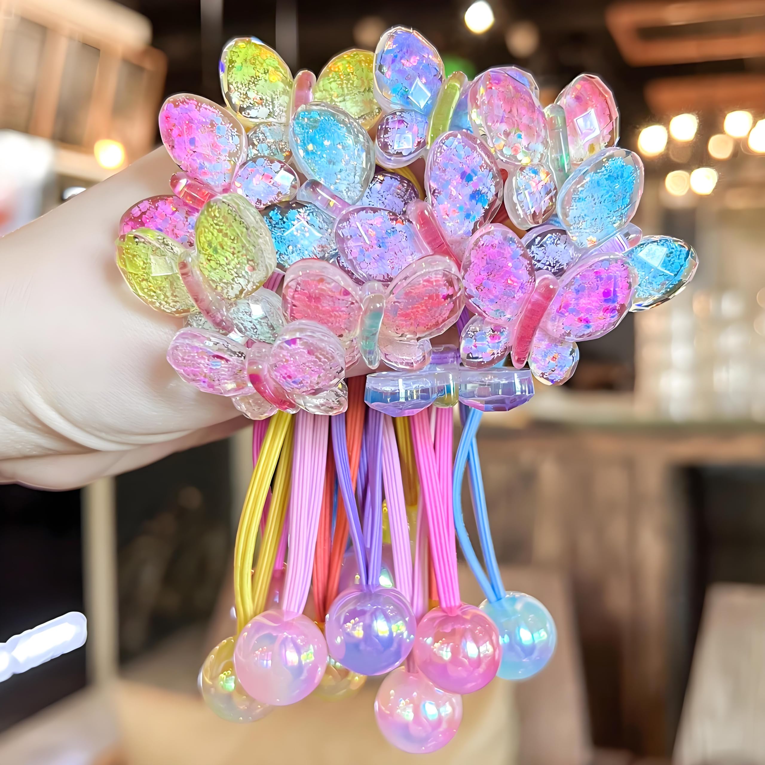 LIYAZHIL pink ball charm hair tie for gentle ponytail styling.