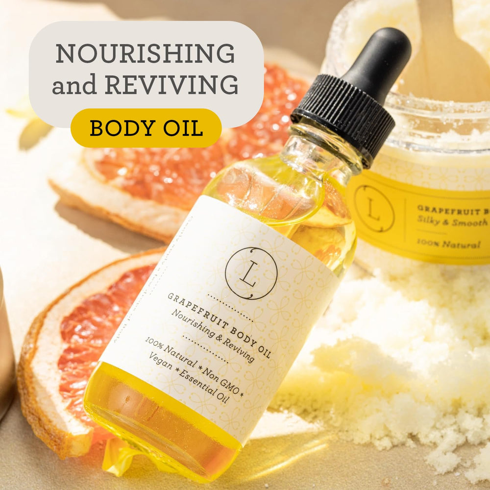 Hands applying Lizush Grapefruit Body Oil for hydrated skin