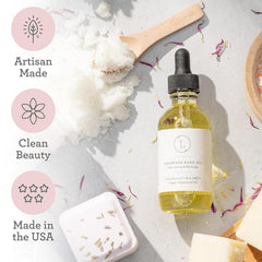 Lizush Lavender Body Oil with lavender sprigs conveys calming aromatherapy.