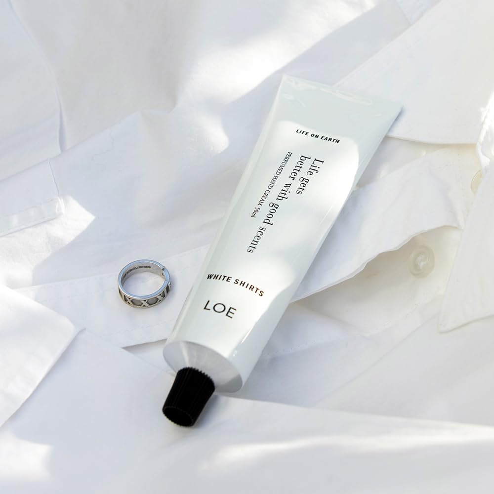 LOE Life On Earth hand cream application shows hydrating texture and scent.