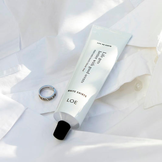 LOE Life On Earth hand cream application shows hydrating texture and scent.