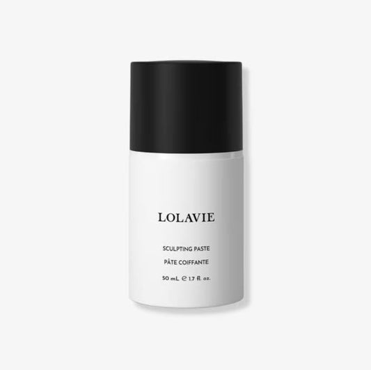 LolaVie Glossing Detangler travel size detangles with shine and frizz control.
