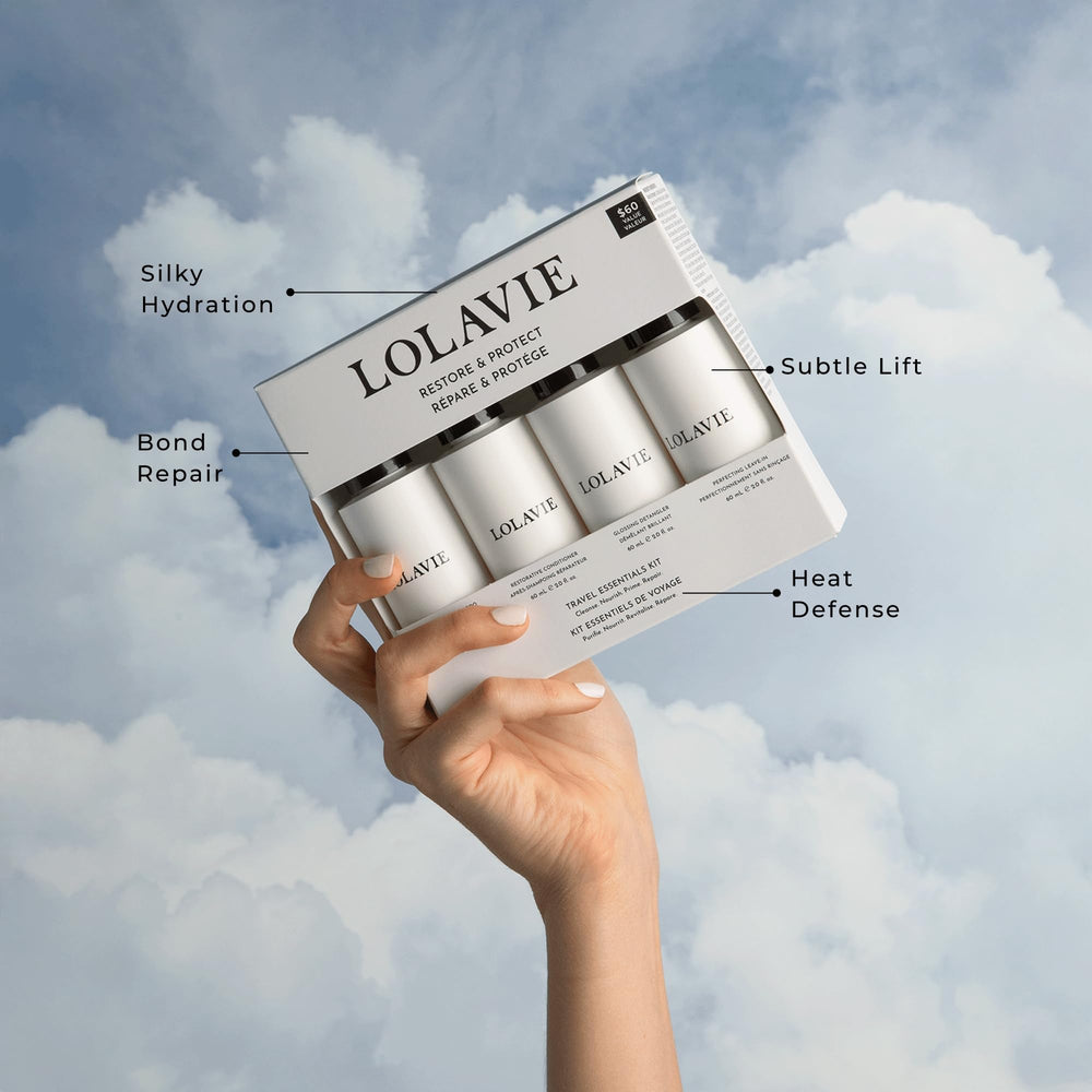 LolaVie Restorative Conditioner travel-size bottle for detangling and silky softness.