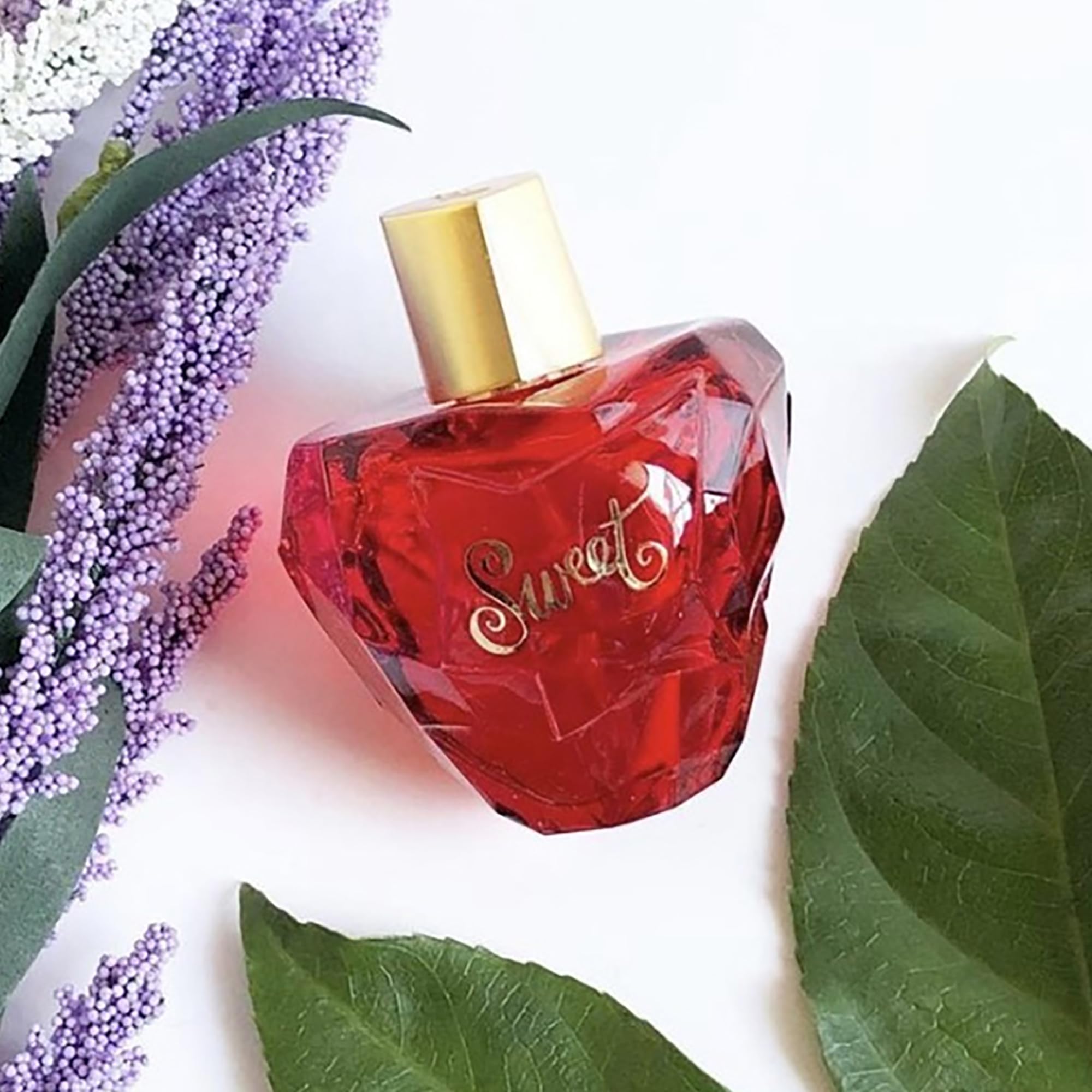 Lolita Lempicka Sweet bottle scent swirl inviting a feminine aura for daily wear