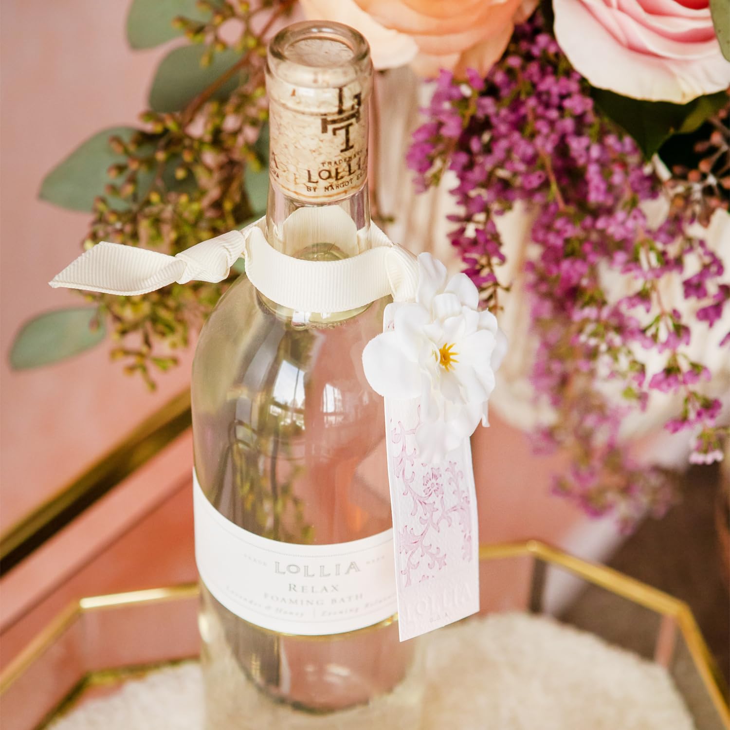 Fragrance notes of Lollia Relax Bubble Bath visible in bottle for aromatic appeal