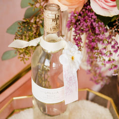 Fragrance notes of Lollia Relax Bubble Bath visible in bottle for aromatic appeal