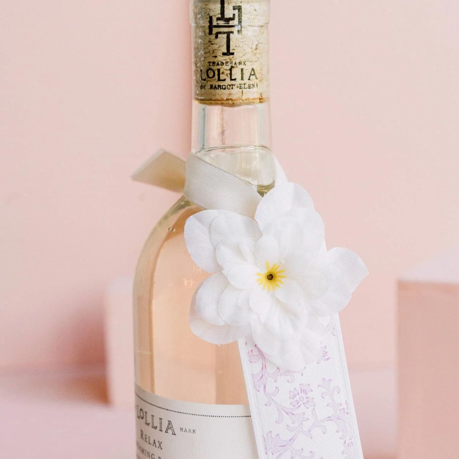 Elegant satin sash on Lollia Relax Bubble Bath bottle for a refined spa-like look