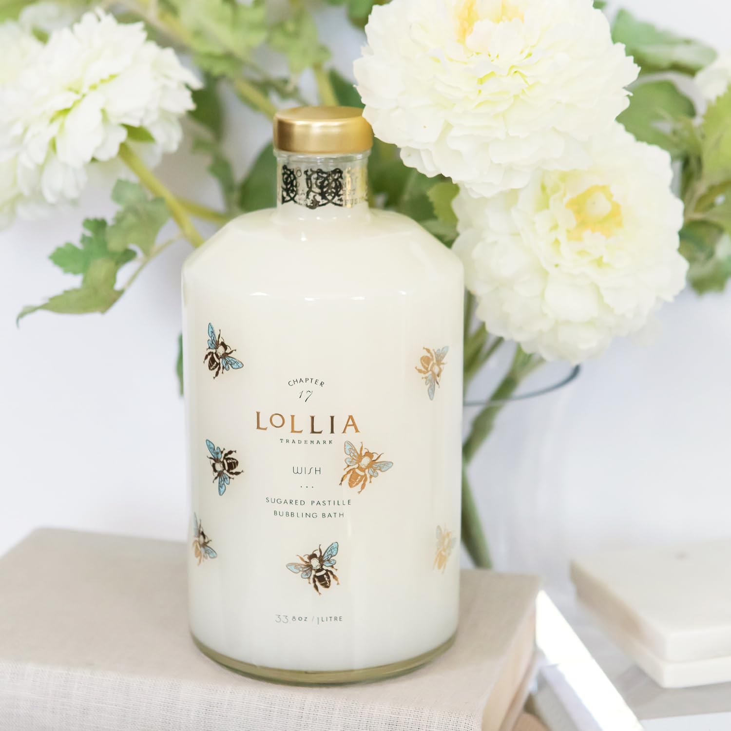 LOLLIA Wish Bubble Bath gold-bees motif on bottle signals luxury.