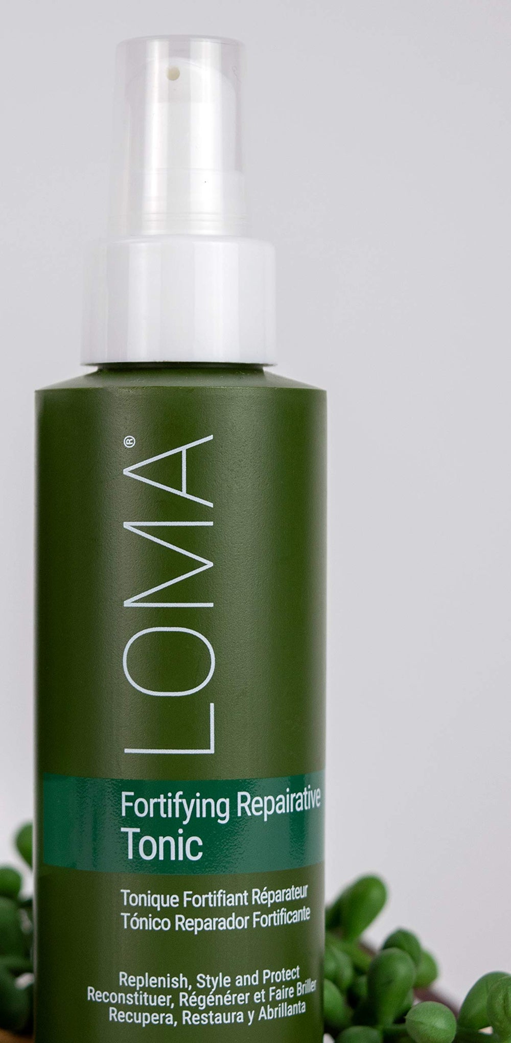 Loma Fortifying Reparative Tonic keratin-cream image shows smoothing and anti-frizz feel.
