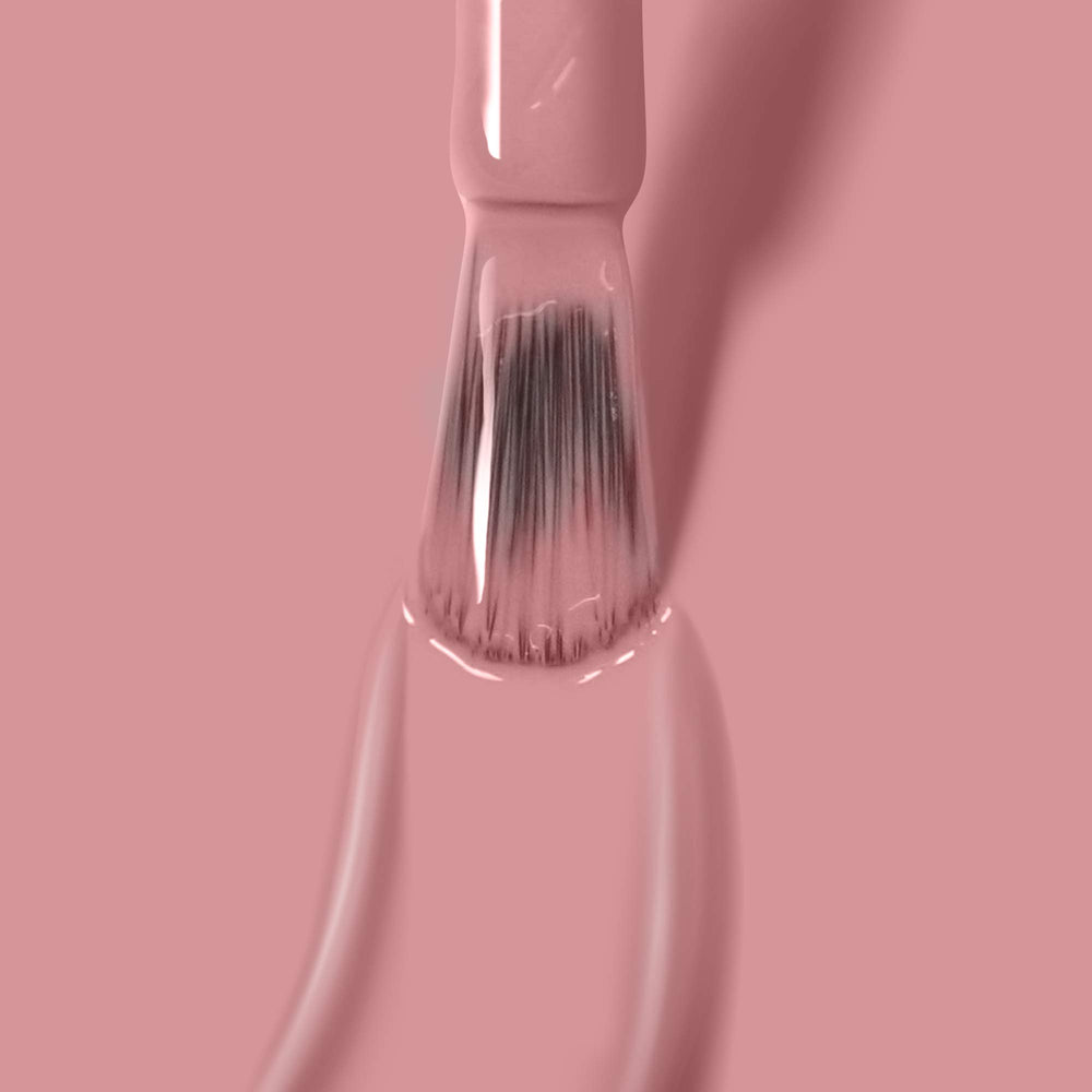 Swatch on nail demonstrates even coverage with a glossy finish.