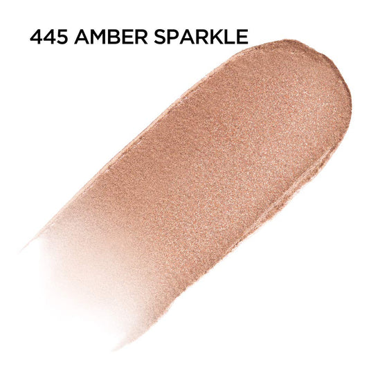 Close-up of doe-foot applicator applying Brilliant Eyes Amber Sparkle with precision