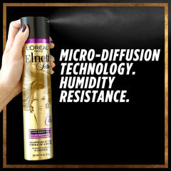 Close-up of L'Oreal Paris Elnett Satin Precious Oils hairspray brushable hold in action.