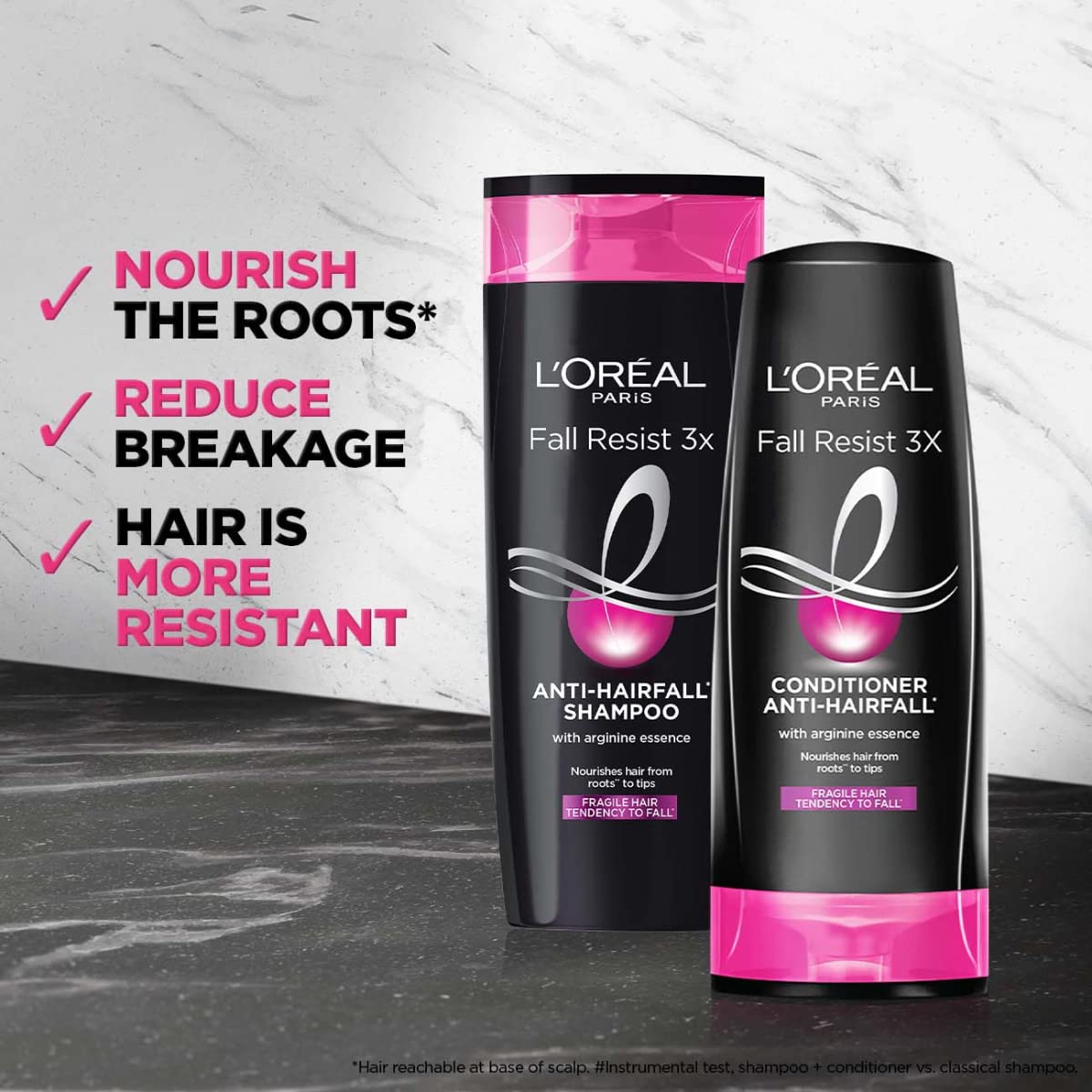 L'Oreal Paris Fall Repair 3X bottle in hand demonstrates portable cleansing option