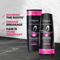 L'Oreal Paris Fall Repair 3X bottle in hand demonstrates portable cleansing option