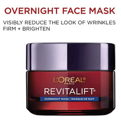 Applying L'Oreal Paris Revitalift triple power overnight mask before bed for smooth distribution.