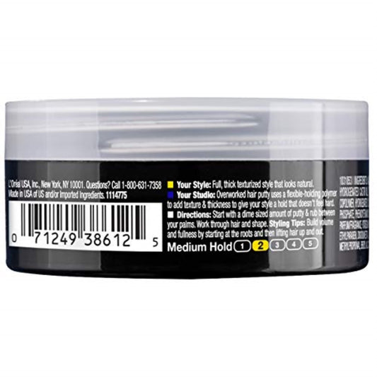 L'Oreal Paris Studio Line Overworked Hair Putty in hands, showing reworkable hold for defined texture.