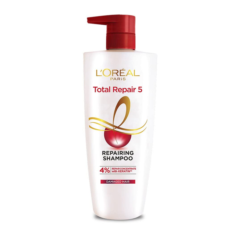 L'Oreal Paris Total Repair 5 Shampoo bottle shows a clear formula for gentle cleansing.