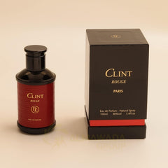 Lorientale Clint Rouge bottle angle, rich amber hues visible.