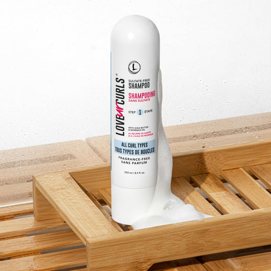 Love Ur Curls fragrance-free shampoo lather showcasing light cleansing without stripping oils.