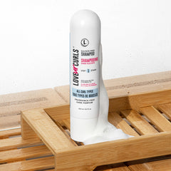 Love Ur Curls fragrance-free shampoo lather showcasing light cleansing without stripping oils.