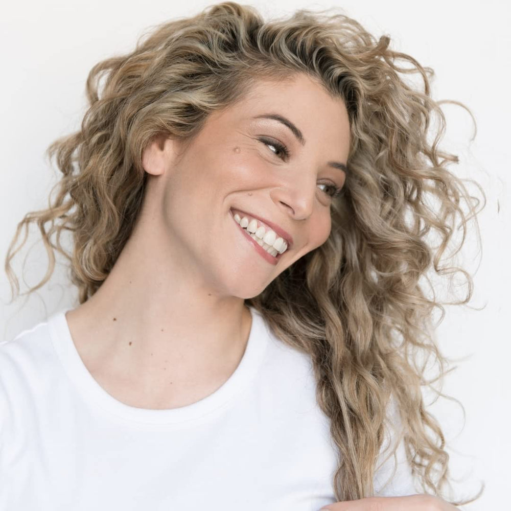 Bathroom scene showing clean, non-greasy finish from Love Ur Curls LUS